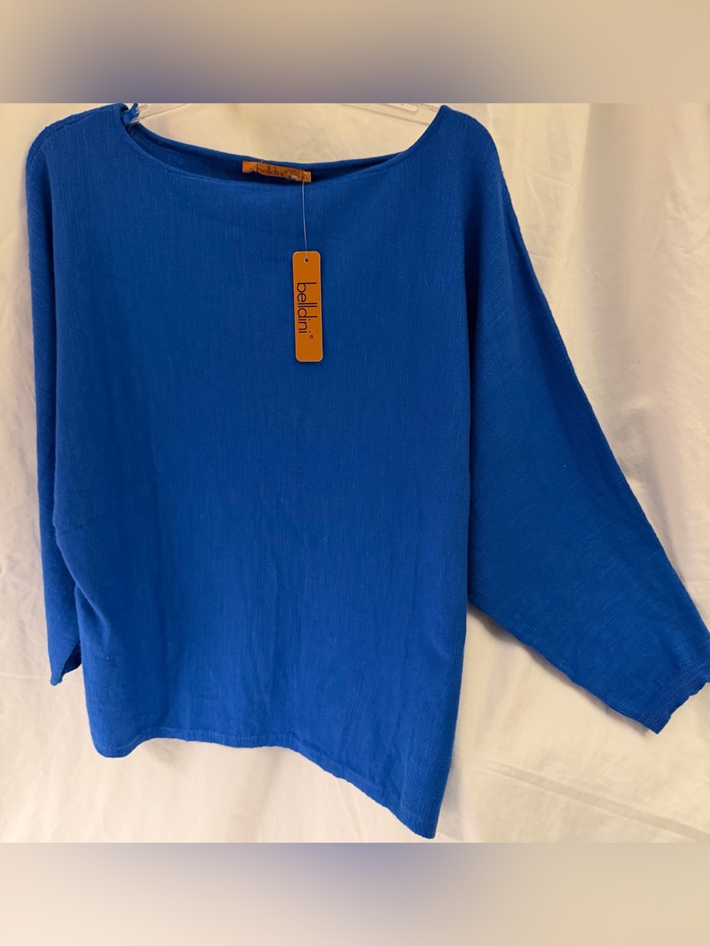 Brilliant blue Belladini top with tags and bat wing sleeves. Size xl